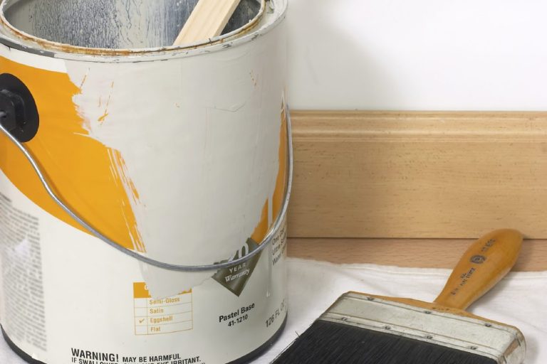 Paint can and paint brush. Handyman Plus Wilson, NC 