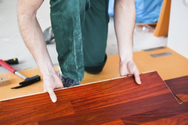 Laminate plank floor installation. Wilson Handyman Plus.